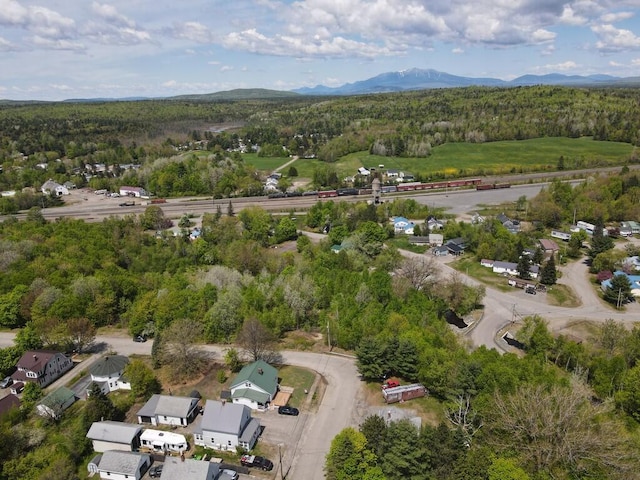 90 E Ter, Millinocket, ME 04462 - aerial view of property's location featuring a forest and a mountainous background