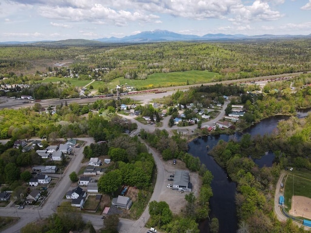 90 E Ter, Millinocket, ME 04462 - aerial view of property and surrounding area featuring a heavily wooded area and a water and mountain view