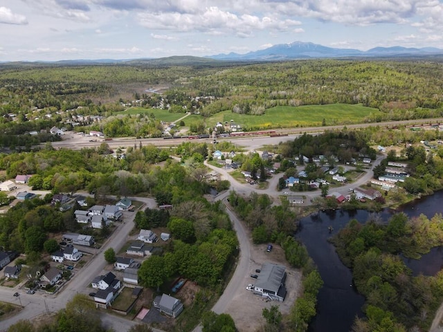 90 E Ter, Millinocket, ME 04462 - aerial view of property's location with a heavily wooded area and a mountainous background