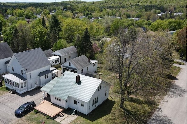 90 E Ter, Millinocket, ME 04462 - aerial view of property and surrounding area featuring a heavily wooded area