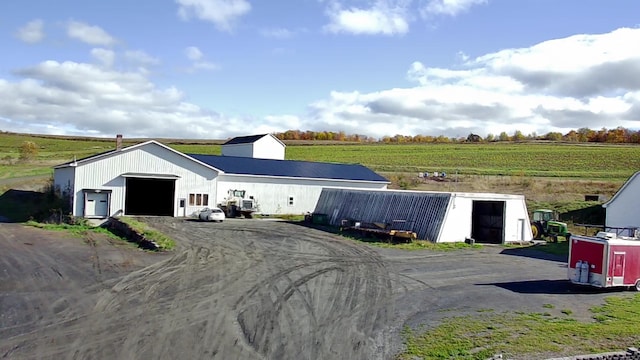 view of outdoor structure with a rural view