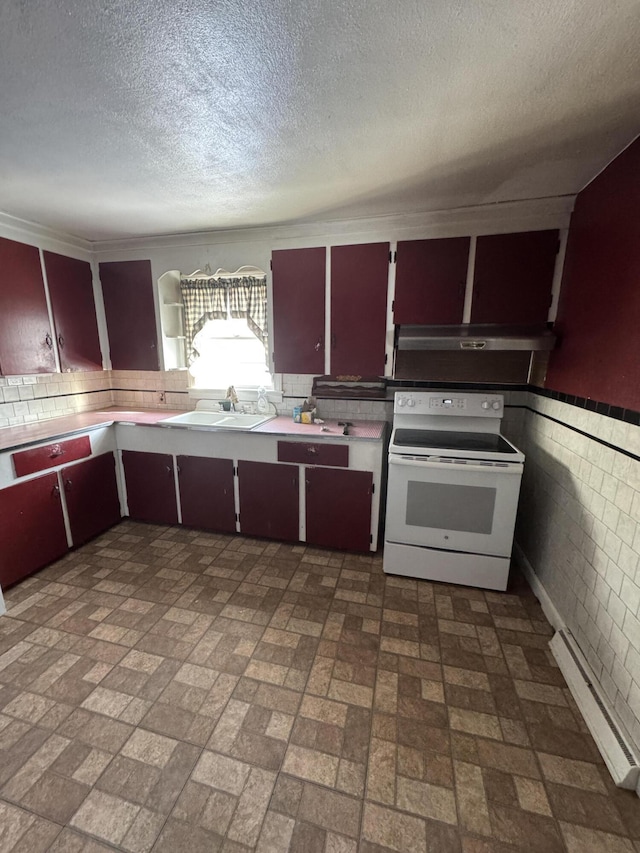 kitchen featuring white electric range oven, a textured ceiling, and sink