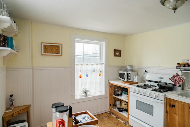 kitchen with white appliances and a wealth of natural light