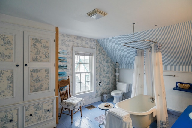 bathroom featuring separate shower and tub, hardwood / wood-style flooring, toilet, and lofted ceiling