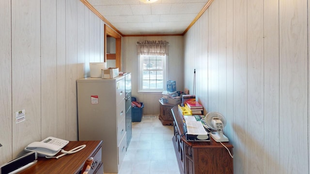 kitchen with crown molding and wooden walls