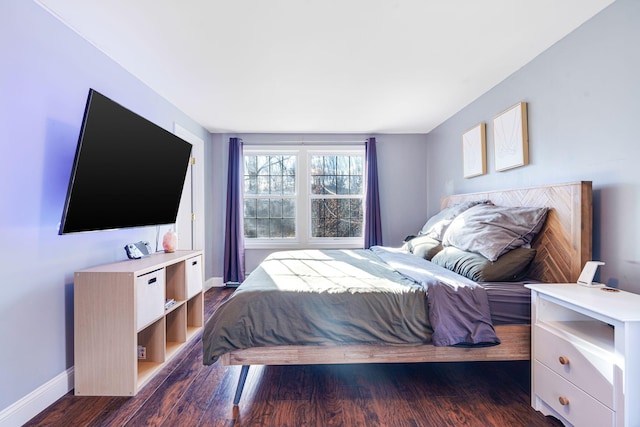 bedroom featuring dark wood-type flooring