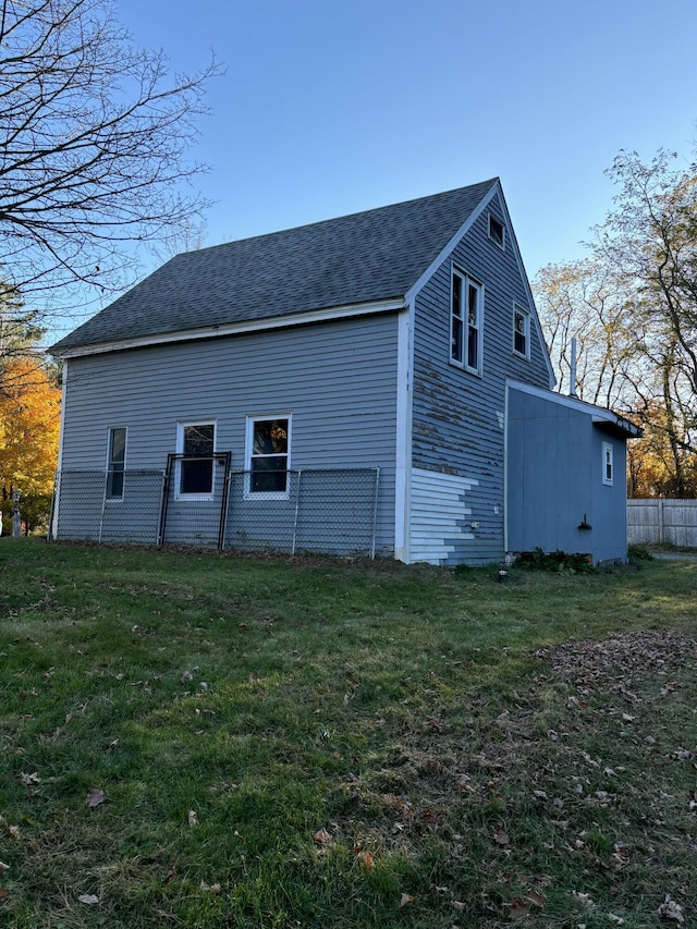 view of property exterior with a yard