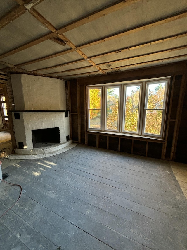 unfurnished living room featuring a fireplace