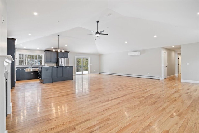 unfurnished living room featuring light wood finished floors, a ceiling fan, lofted ceiling, a baseboard radiator, and a wall mounted air conditioner