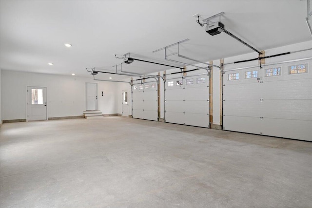 garage featuring baseboards, recessed lighting, and a garage door opener