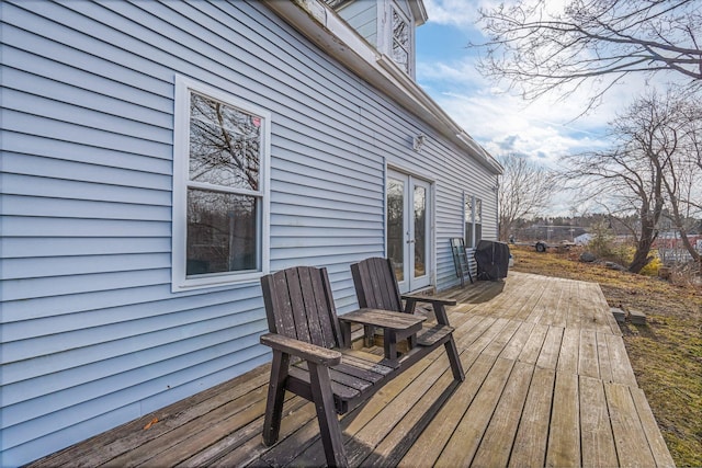 wooden deck featuring french doors