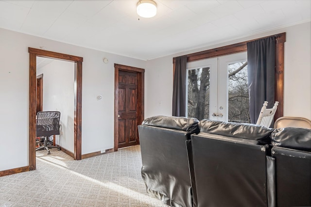 carpeted living room with french doors