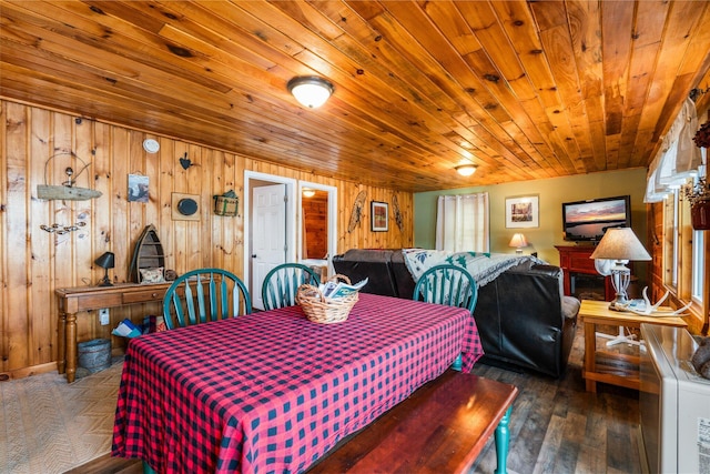 13 W Orchard Ln, Swanville, ME 04915 - dining area featuring wood walls, hardwood / wood-style floors, and wooden ceiling