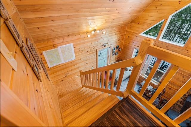 stairway with wooden walls and wooden ceiling