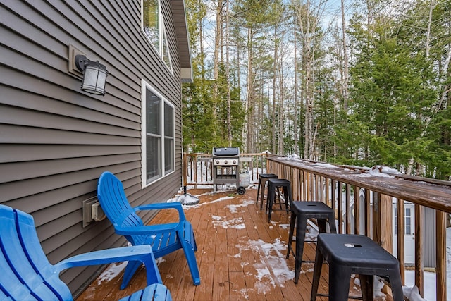 snow covered deck with area for grilling