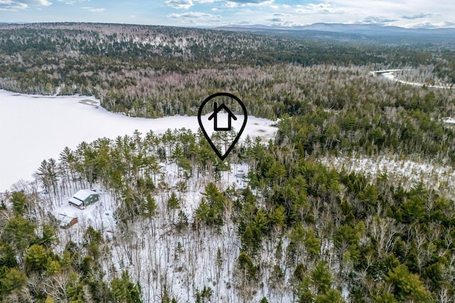 snowy aerial view featuring a mountain view