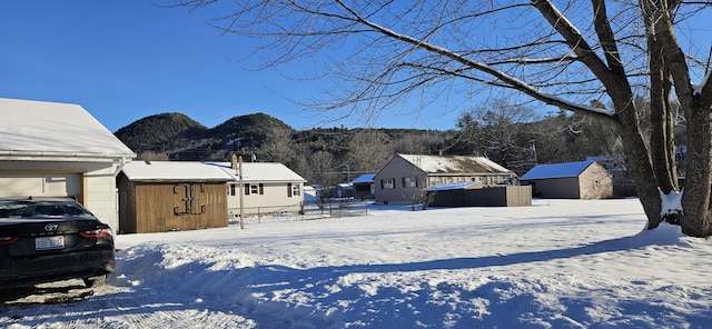 exterior space featuring a mountain view and a shed