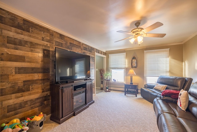 carpeted living room with baseboard heating, crown molding, wooden walls, and ceiling fan