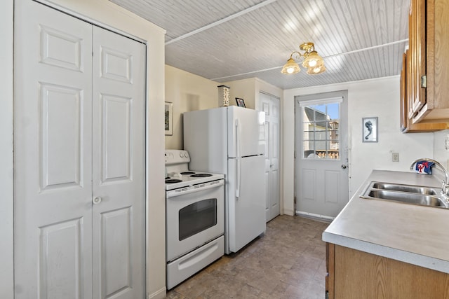 kitchen with white appliances, light countertops, wooden ceiling, and a sink