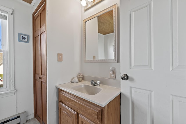 bathroom with baseboard heating and vanity