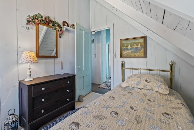 bedroom featuring lofted ceiling