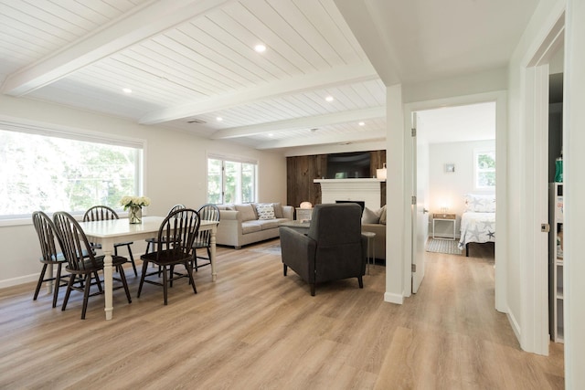 dining area featuring wooden ceiling, beam ceiling, and light hardwood / wood-style flooring