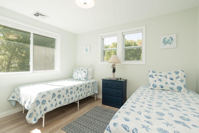 bedroom with light wood-type flooring