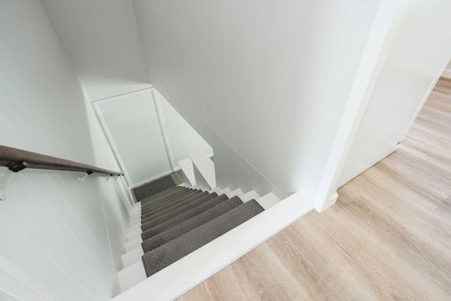 staircase with wood-type flooring