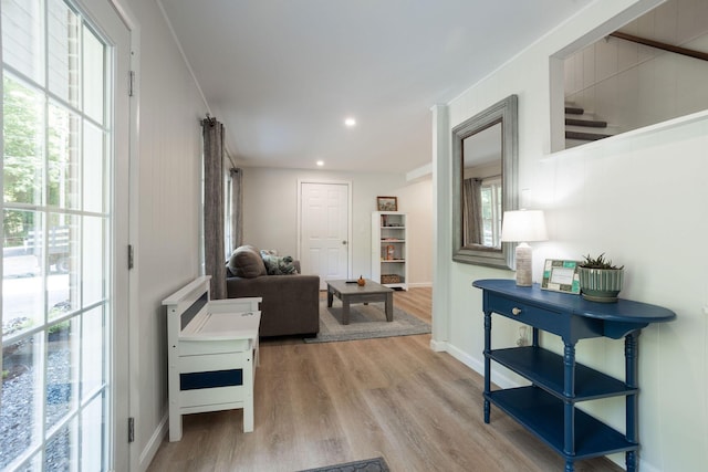 corridor with light hardwood / wood-style floors