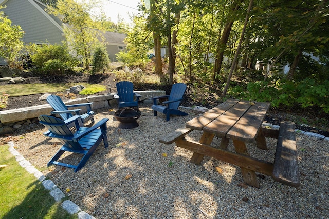 view of yard with a fire pit