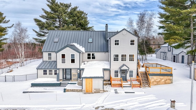 view of snow covered house