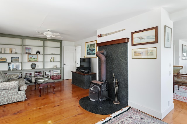 95 Pumpkin Cove Rd, Bristol, ME 04554 - living room with ceiling fan, wood-type flooring, and a wood stove