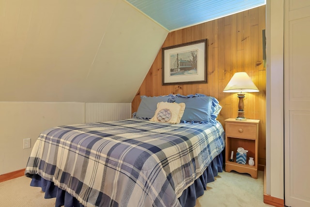 carpeted bedroom featuring vaulted ceiling