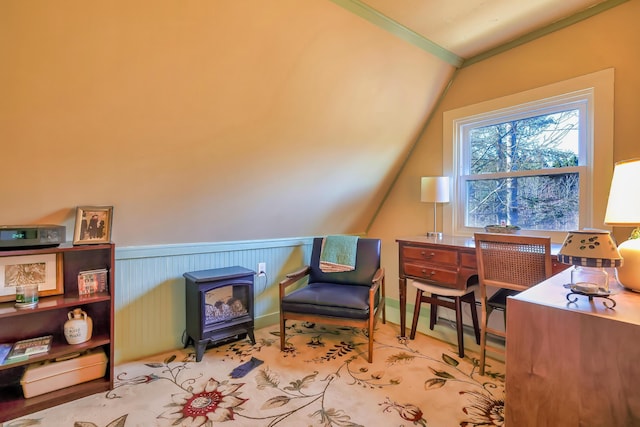 living area with crown molding and lofted ceiling