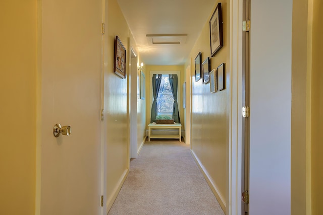 hall with light colored carpet