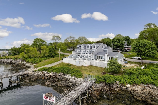 rear view of property with a deck with water view