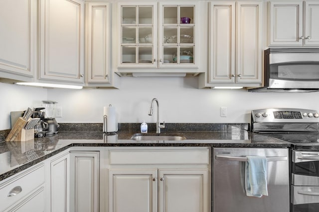 kitchen featuring sink, white cabinets, and appliances with stainless steel finishes