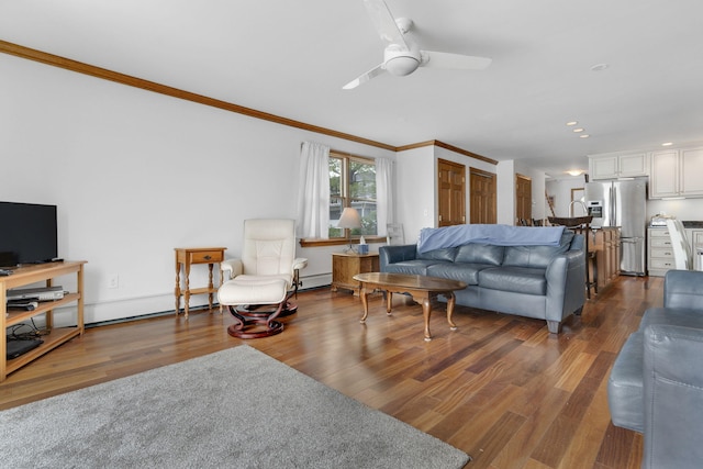 living room with dark hardwood / wood-style floors, ceiling fan, and crown molding