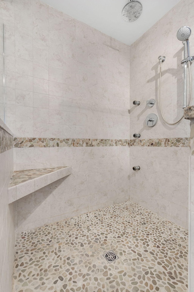 bathroom with tiled shower