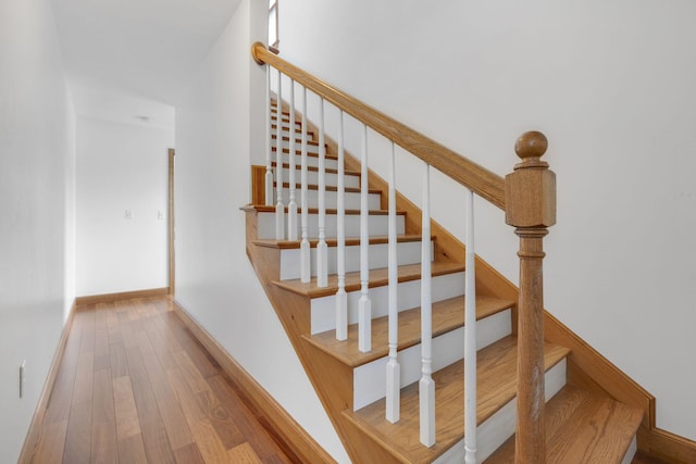 stairway featuring wood-type flooring