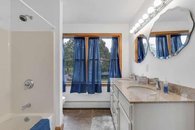 full bathroom with vanity, bathing tub / shower combination, tile patterned flooring, toilet, and baseboard heating