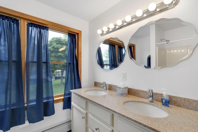 bathroom with vanity and a baseboard heating unit