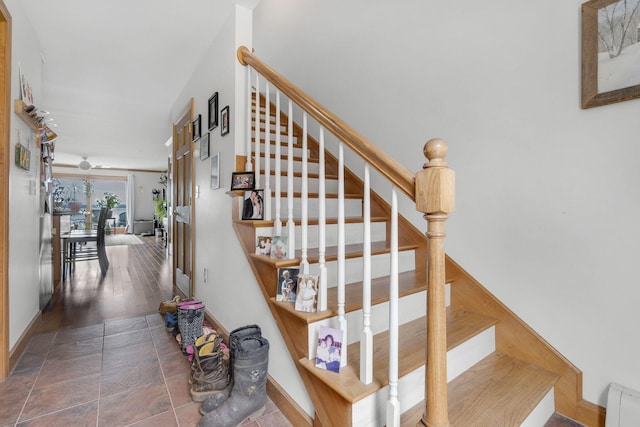 stairway with hardwood / wood-style flooring