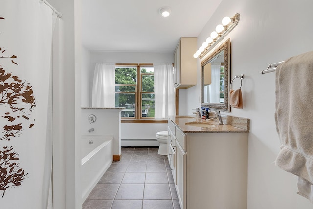 bathroom featuring tile patterned floors, vanity, a baseboard heating unit, toilet, and a bathing tub