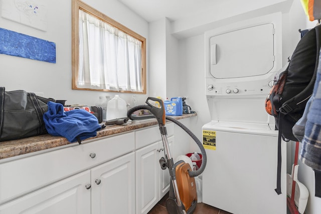 laundry area with stacked washer / dryer