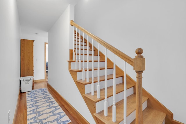 stairs with wood-type flooring