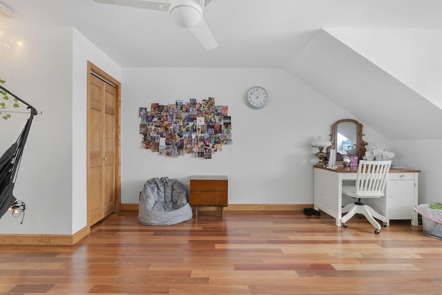 office space featuring light hardwood / wood-style flooring, ceiling fan, and lofted ceiling