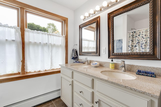 bathroom with vanity, a baseboard radiator, and walk in shower