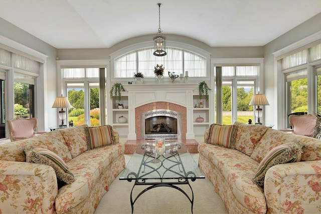 carpeted living room with a healthy amount of sunlight