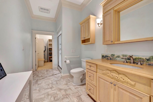 bathroom with vanity, toilet, and crown molding